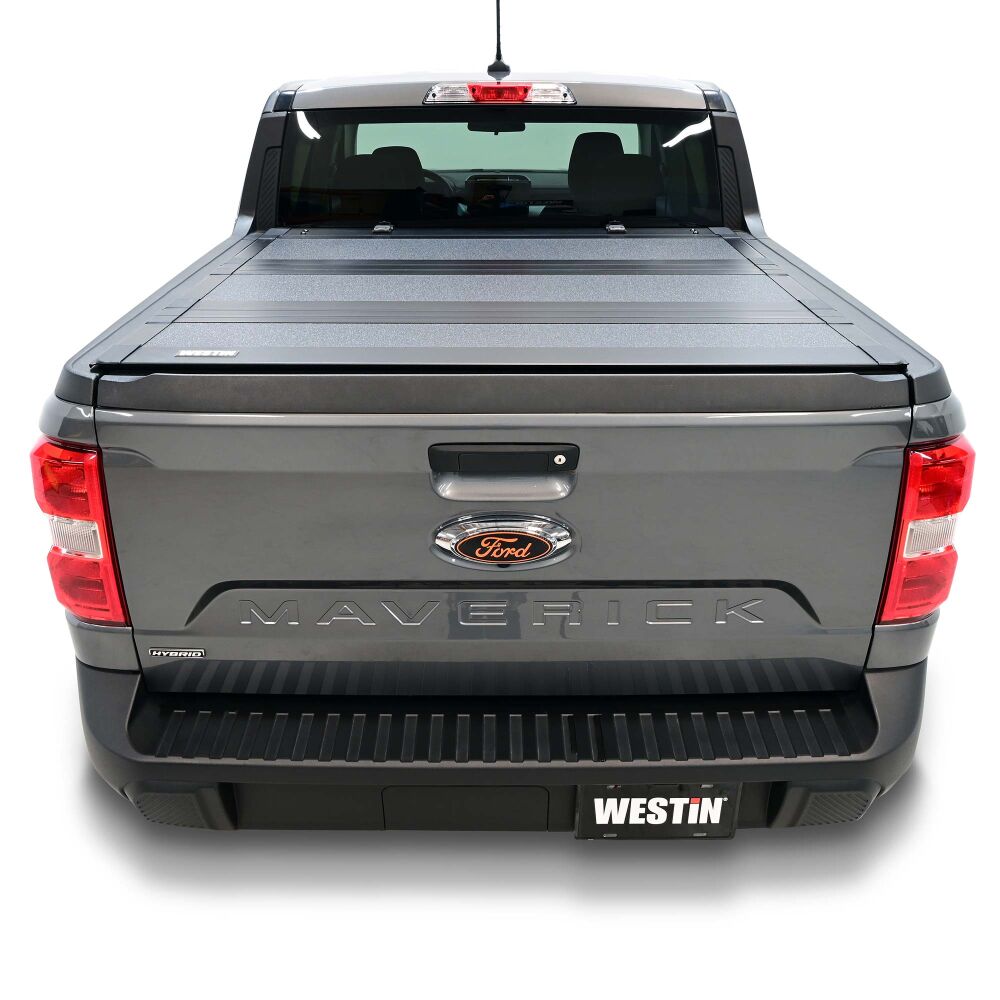 Westin Hard Tri-Fold Tonneau Cover on a pickup truck, featuring rugged design and secure fit.